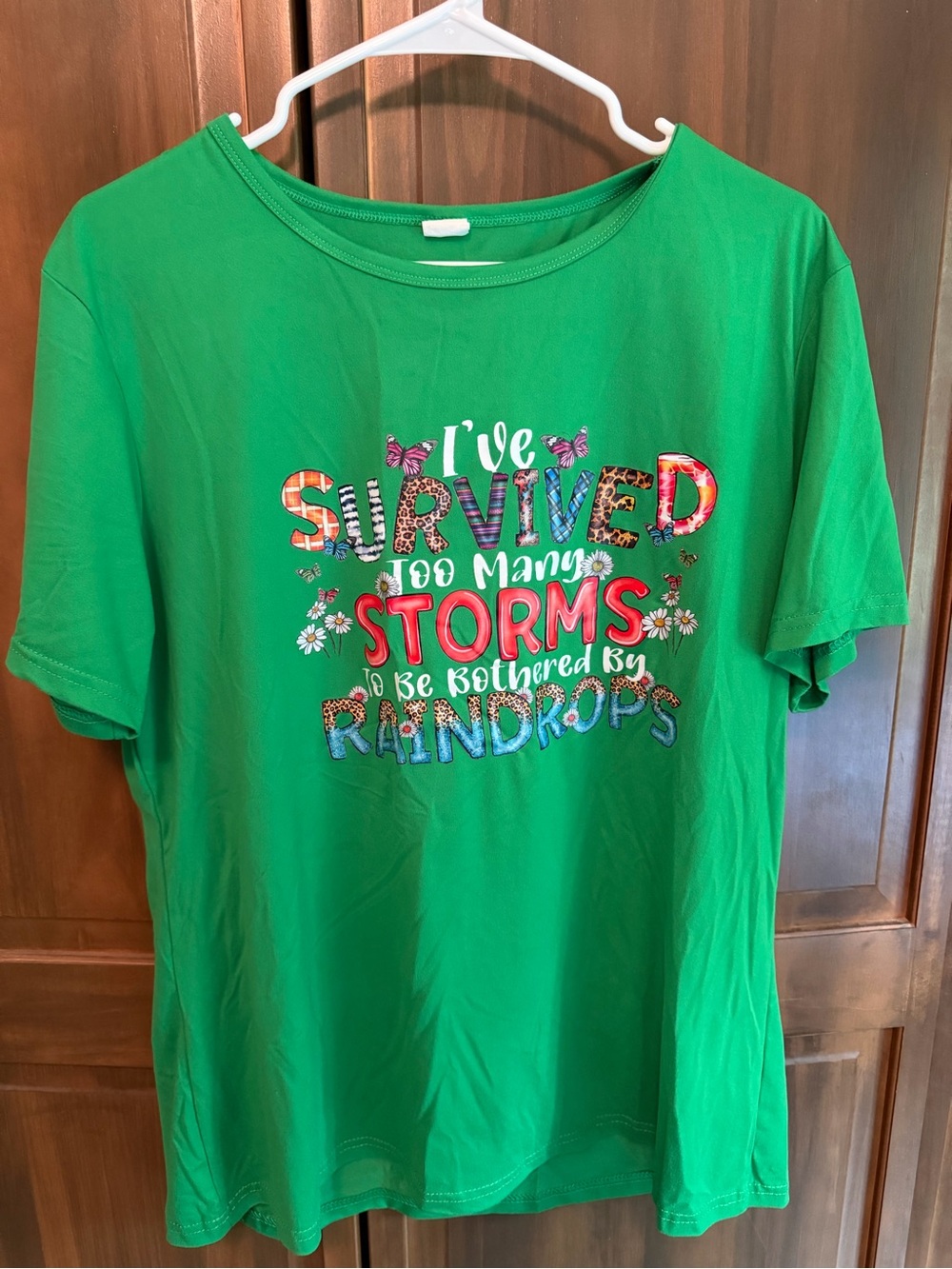 Women's Green Short Sleeve Graphic Tee - I've Survived Too Many Storms